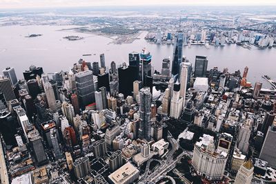 High angle view of cityscape by sea