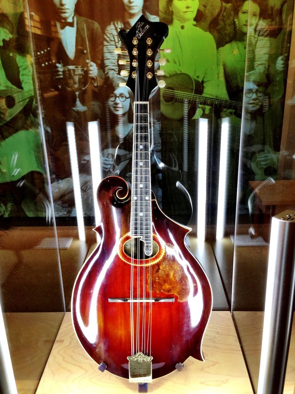 indoors, table, music, musical instrument, arts culture and entertainment, still life, illuminated, wood - material, chair, guitar, close-up, home interior, candle, lighting equipment, no people, absence, musical equipment, vase, fire - natural phenomenon, high angle view