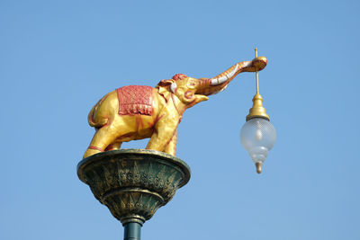 Low angle view of street light against clear sky