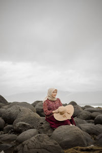 A woman is enjoying a vacation on a beach in indonesia