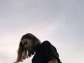 Portrait of woman against sky