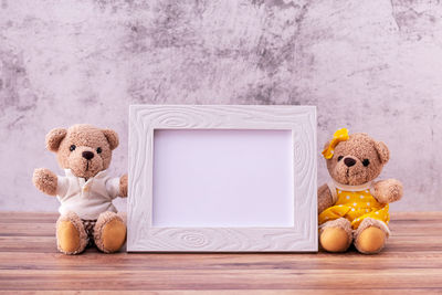 Toys on table against wall