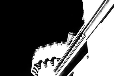 Low angle view of silhouette staircase against clear sky