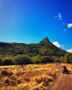 Scenic view of mountains against clear blue sky