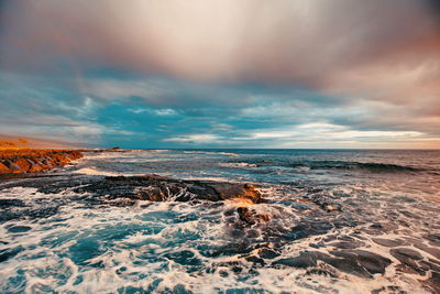 Scenic view of sea against sky during sunset