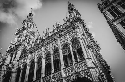 Low angle view of ornate building against sky