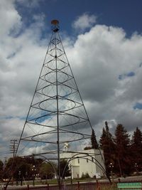 Low angle view of building against cloudy sky