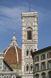 Low angle view of bell tower against sky