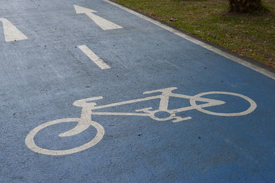 High angle view of arrow symbol on road