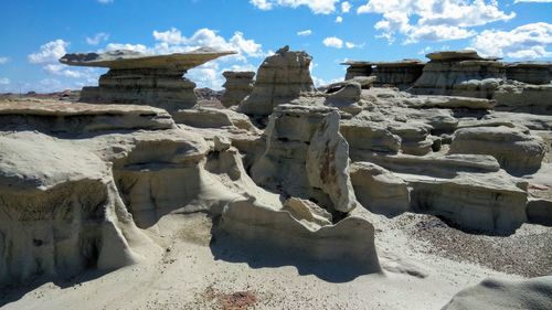 View of rocks against cloudy sky