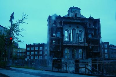 Low angle view of building against blue sky
