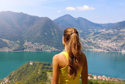 Rear view of woman looking at mountains