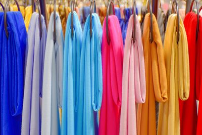 Close-up of multi colored clothes hanging on rack