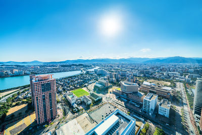 High angle view of road by buildings against sky