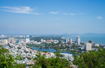 High angle view of buildings in city against sky