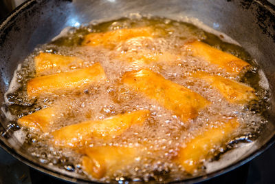 High angle view of meat in cooking pan