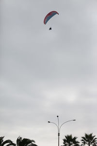 Low angle view of kite flying in sky