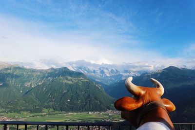 Cow statue against mountains