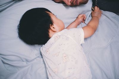 Baby sleeping on bed