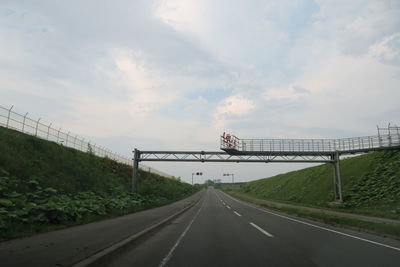 View of bridge over road against sky