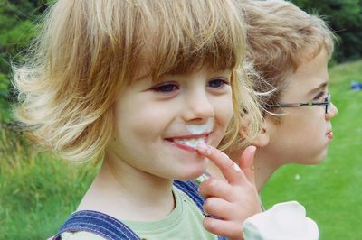 Portrait of cute smiling girl holding ice cream