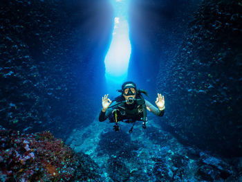 Portrait of woman scuba diving in sea