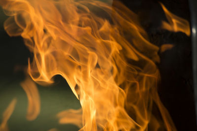 Close-up of bonfire against black background