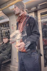 Full length of young man standing at train