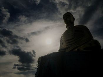 Low angle view of statue against cloudy sky