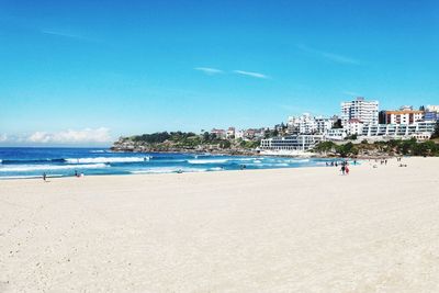 View of beach against blue sky