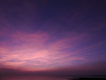 Scenic view of sea against sky at sunset