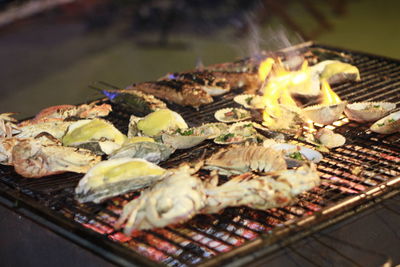 Close-up of meat on barbecue grill