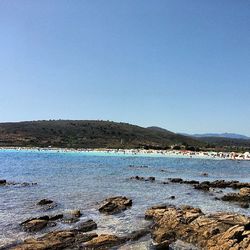 Scenic view of calm sea against clear sky