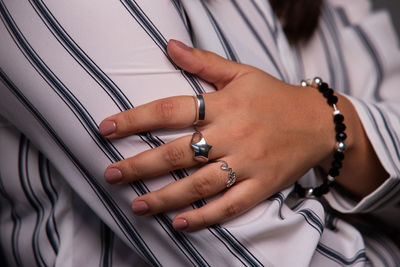 Close-up of woman hand on the wall