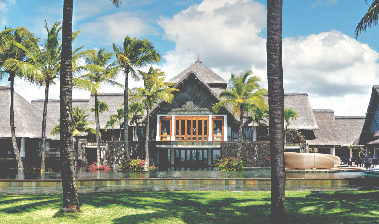 architecture, built structure, building exterior, house, water, tree, no people, sky, palm tree, day, cloud - sky, residential building, outdoors, grass, swimming pool, nature