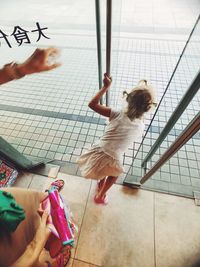 High angle view of woman holding umbrella