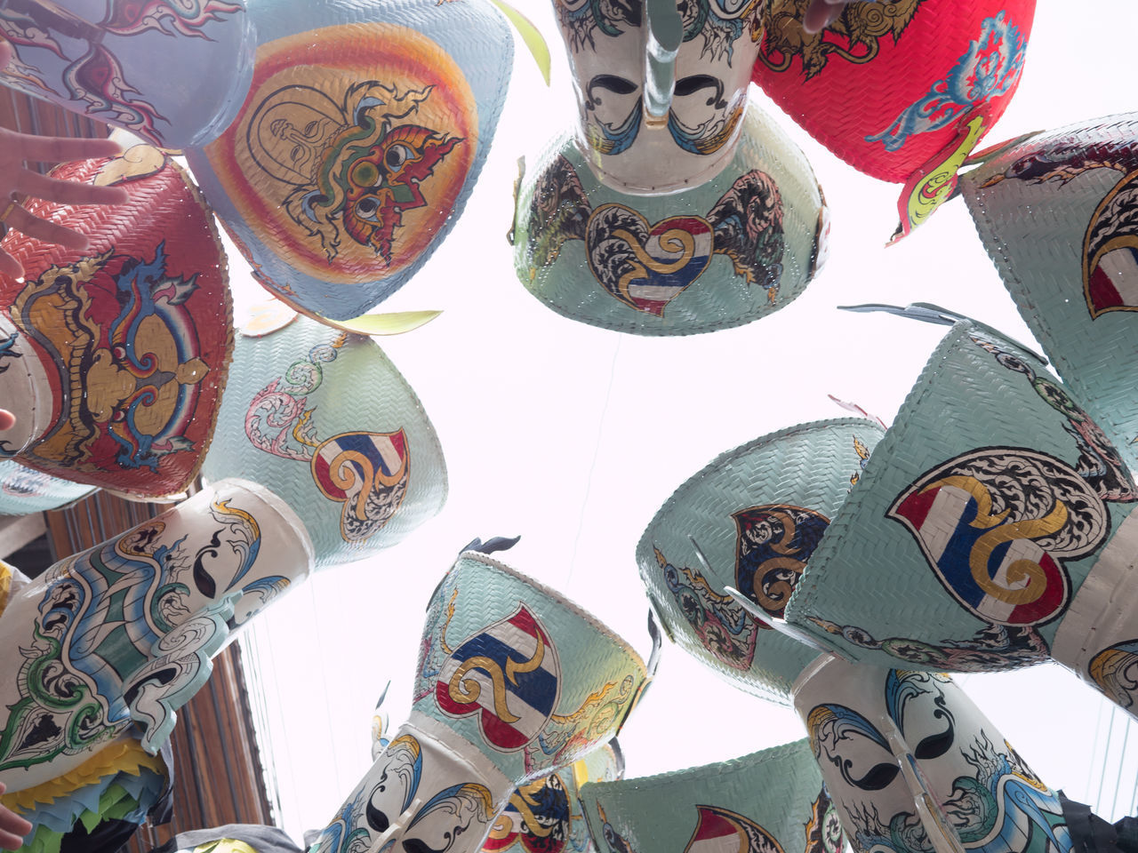 LOW ANGLE VIEW OF DECORATIONS HANGING AGAINST CEILING