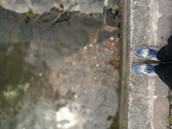 Low section of man standing outdoors
