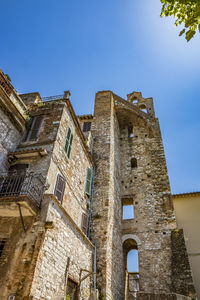 Low angle view of old building against clear sky