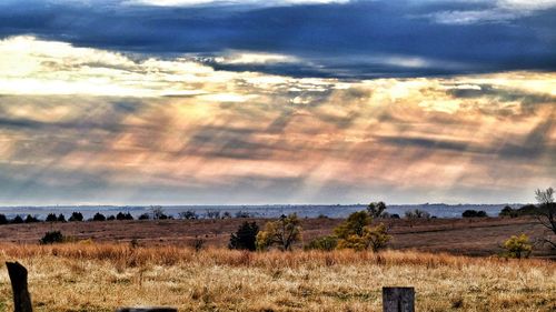 Scenic view of landscape against cloudy sky