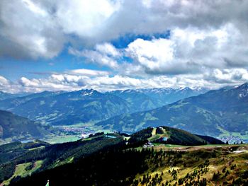 Scenic view of mountains against cloudy sky