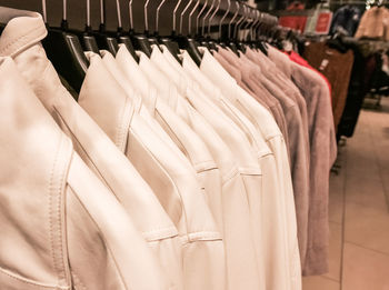 Close-up of clothes hanging in store