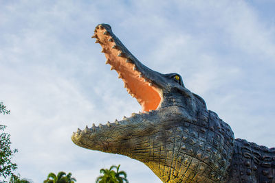 Low angle view of bird sculpture against sky