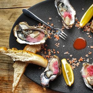 High angle view of oysters on serving dish on  table
