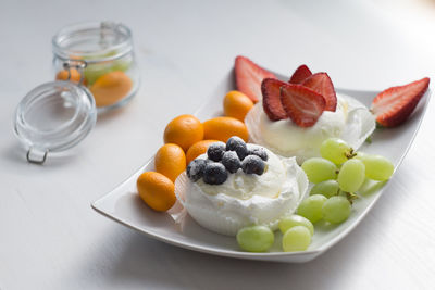 High angle view of fruits in plate on table