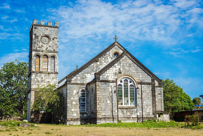 Facade of historic building against sky