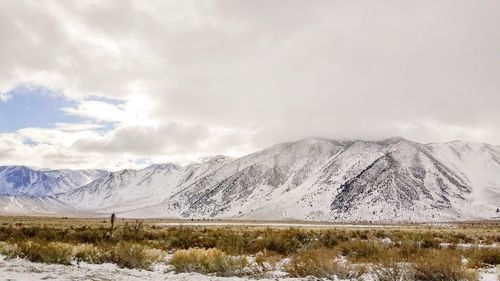 Scenic view of snowcapped mountains against sky