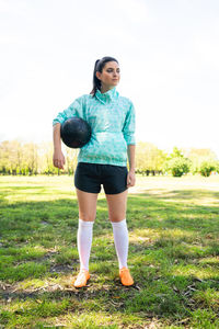 Full length of woman standing on field