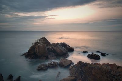 Scenic view of sea against sky during sunset