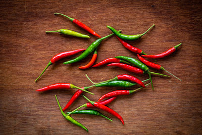 Close-up of red chili peppers on table